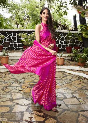 Shine Bright In This Very Pretty Designer Saree In Rani Pink Color Paired With Rani Pink Colored Blouse. This Saree And Blouse Are Fabricated on Kota Brasso Which Is Light Weight And Easy To Carry All Day Long. 
