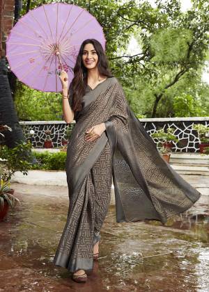 Flaunt Your Rich And Elegant Taste Wearing This Designer Saree In Elegant Grey Color. This Saree and Blouse Are Fabricated On Kota Brasso Beautified With Prints All Over. Its Rich Color And Fabric Will Definitely Earn You Lots Of Compliments From Onlookers. 