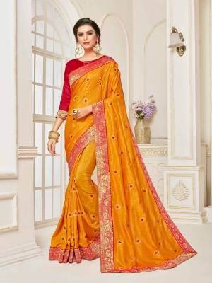 Celebrate This Festive Season Wearing This Designer Silk Based Saree In Musturd Yellow Color Paired With Contrasting Red Colored Blouse. This Saree Is Beautified With Small Embroidered Buttis And Jacquard Lace Border. 