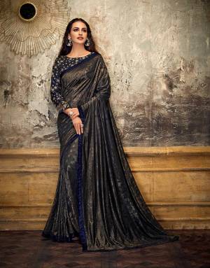 Let this timeless gem of a saree behold multiple eyes in much awe as you sashay around looking glitzy and glamourous. Pair with statement earrings to look our best. 