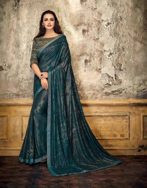 Dive into the spirit of monochromes this fashion season and adorn this Teal Blue monochrom saree-blouse adorned with the perfect touch of gold and look ethereal.