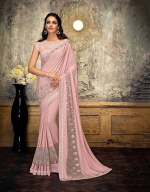 Style and substance will be yours in this subtle, romantic Baby Pink saree embellished with delicate beads and flower appliques.  Pair with delicate jewels to appear pretty. 