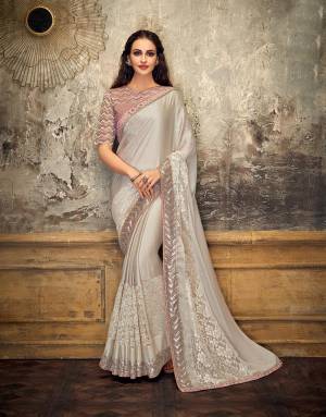 Define a dazzling stature to an otherwise subtle appearance in this perfectly stylized saree . Opt for a free-falling drape to make the most out of this beauty. 