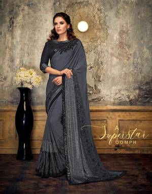 Ooze a superstar-like oomph in this very basic yet outstanding black and grey saree. Pair with statement studs and be the talk of the town, 
