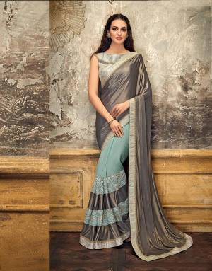 Make a statement in this stylishly designed saree that?s a perfect combination of bright and shimmy. Give those hair a messy look and look divaesque. 