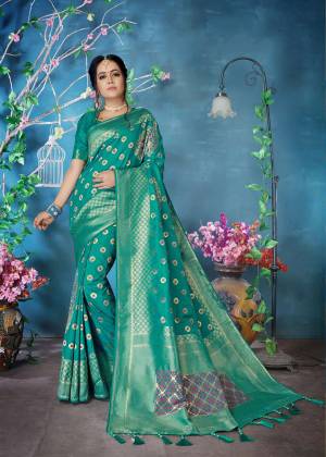 Add This Very Pretty Designer Silk Based Saree In Sea Green Color Paired With Sea Green Colored Blouse. This Saree And Blouse Are Fabricated On Banarasi Art Silk Beautified With Weave All Over It. 