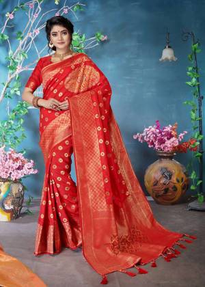 Adorn The Pretty Angelic Look Wearing This Designer Silk Based Saree In Red Color. This Saree and Blouse Are Fabricated On Banarasi Art Silk Beautified With Weave. 