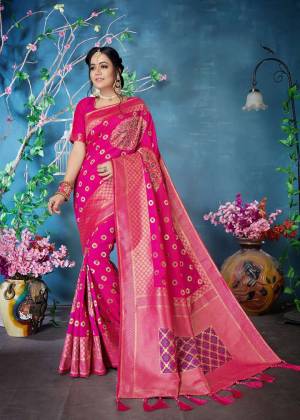 Shine Bright Wearing This Designer Silk Based Saree In Dark Pink Color Paired With Dark Pink Colored Blouse. This Saree And Blouse are Fabricated On Banarasi Art Silk Beautified With Weave. 