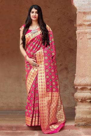 Flaunt Your Rich And Elegant Taste In Silk With This Subtle Weaved Saree In Rani Pink Color. This Saree And Blouse Are Fabricated On Banarasi Patola Beautified With Pretty Small Butti Weave All Over It. Its Silk Based Fabric Will Give A Rich Look To Your Personality
