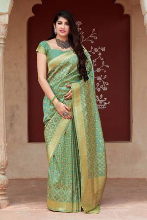 Flaunt Your Rich And Elegant Taste In Silk With This Subtle Weaved Saree In Light Green Color. This Saree And Blouse Are Fabricated On Tussar Art Silk Beautified With Pretty Small Butti Weave All Over It. Its Silk Based Fabric Will Give A Rich Look To Your Personality