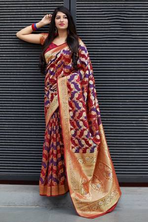 Flaunt Your Rich And Elegant Taste In Silk With This Subtle Weaved Saree In Red And Violet Color. This Saree And Blouse Are Fabricated On Banarasi Patola Beautified With Pretty Small Butti Weave All Over It. Its Silk Based Fabric Will Give A Rich Look To Your Personality