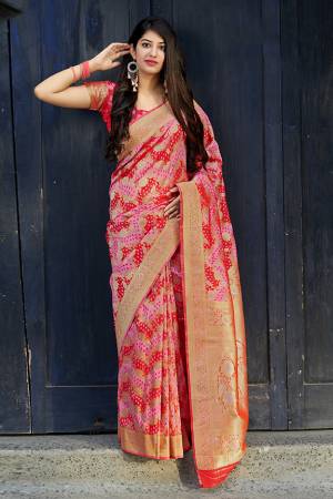 Celebrate This Festive Season With Beauty And Comfort In This Elegant Looking Designer Silk Based Saree In Red And Pink Color. This Saree And Blouse Are Fabricated On Banarasi Satin Beautified With Small Butti Weave All Over. Buy Now.?