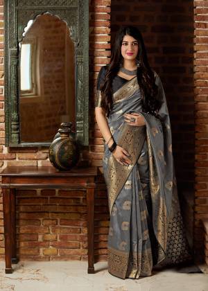 Celebrate This Festive Season With Beauty And Comfort In This Elegant Looking Designer Silk Based Saree In Grey Color. This Saree And Blouse Are Fabricated On Banarasi Art Silk Beautified With Small Butti Weave All Over. Buy Now.?