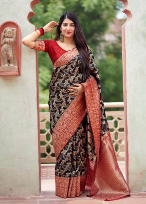 Flaunt Your Rich And Elegant Taste In Silk With This Subtle Weaved Saree In Black Color. This Saree And Blouse Are Fabricated On Banarasi Art Silk Beautified With Pretty Small Butti Weave All Over It. Its Silk Based Fabric Will Give A Rich Look To Your Personality