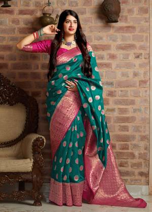 Celebrate This Festive Season With Beauty And Comfort In This Elegant Looking Designer Silk Based Saree In Teal Blue Color. This Saree And Blouse Are Fabricated On Banarasi Art Silk Beautified With Small Butti Weave All Over. Buy Now.?