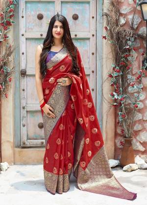 Flaunt Your Rich And Elegant Taste In Silk With This Subtle Weaved Saree In Red Color. This Saree And Blouse Are Fabricated On Banarasi Art Silk Beautified With Pretty Small Butti Weave All Over It. Its Silk Based Fabric Will Give A Rich Look To Your Personality