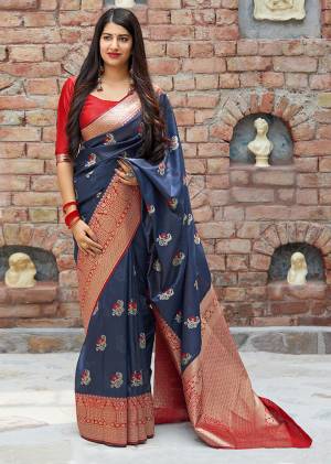 Flaunt Your Rich And Elegant Taste In Silk With This Subtle Weaved Saree In Navy Blue Color. This Saree And Blouse Are Fabricated On Banarasi Art Silk Beautified With Pretty Small Butti Weave All Over It. Its Silk Based Fabric Will Give A Rich Look To Your Personality