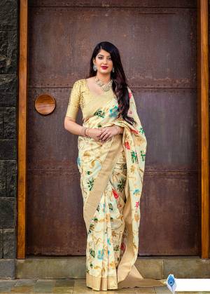 Celebrate This Festive Season With Beauty And Comfort In This Elegant Looking Designer Silk Based Saree In Cream Color. This Saree And Blouse Are Fabricated On Banarasi Art Silk Beautified With Small Butti Weave All Over. Buy Now.?
