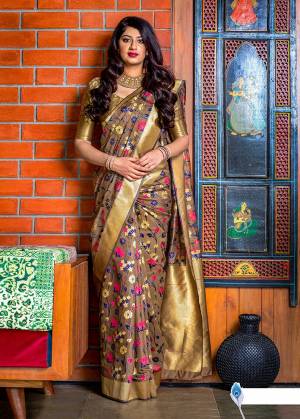 Flaunt Your Rich And Elegant Taste In Silk With This Subtle Weaved Saree In Light Brown Color. This Saree And Blouse Are Fabricated On Banarasi Art Silk Beautified With Pretty Small Butti Weave All Over It. Its Silk Based Fabric Will Give A Rich Look To Your Personality