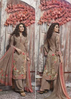 Flaunt Your Rich And Elegant Taste Wearing This Designer Dress Material In Beige Color. This Pretty Digital Printed Dress Material Is Fabricated On Crepe Paired With Georgette Fabricated Dupatta. Buy Now.