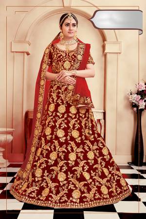 Be The Prettiest Bride Wearing This Very Beautiful And Heavy Embroidered Designer Bridal Lehenga Choli In Red Color. This Lehenga Choli Is Velvet Based Paired With Net Fabricated Dupatta. Buy This Beautiful Lehenga Choli Now.