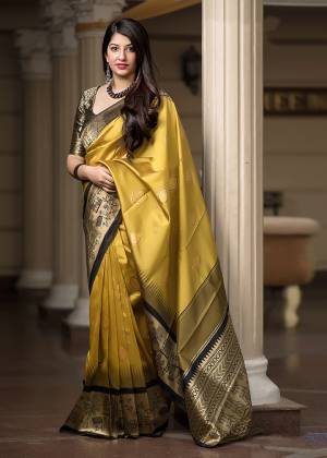 Celebrate This Festive Season With Beauty And Comfort In This Elegant Looking Designer Silk Based Saree In Yellow And Black Color. This Saree And Blouse Are Fabricated On Banarasi Art Silk Beautified With Small Butti Weave All Over. Buy Now.