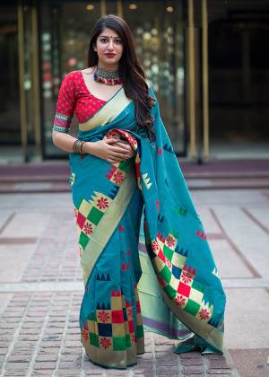 Flaunt Your Rich And Elegant Taste In Silk With This Subtle Weaved Saree In Blue And Dark Pink Color. This Saree And Blouse Are Fabricated On Banarasi Art Silk Beautified With Pretty Small Butti Weave All Over It. Its Silk Based Fabric Will Give A Rich Look To Your Personality