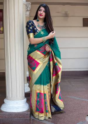 Flaunt Your Rich And Elegant Taste In Silk With This Subtle Weaved Saree In Sea Green And Navy Blue Color. This Saree And Blouse Are Fabricated On Banarasi Art Silk Beautified With Pretty Small Butti Weave All Over It. Its Silk Based Fabric Will Give A Rich Look To Your Personality