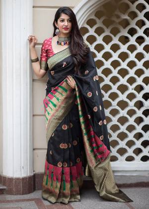 Celebrate This Festive Season With Beauty And Comfort In This Elegant Looking Designer Silk Based Saree In Black And Dark Pink Color. This Saree And Blouse Are Fabricated On Banarasi Art Silk Beautified With Small Butti Weave All Over. Buy Now.