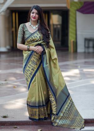 Flaunt Your Rich And Elegant Taste In Silk With This Subtle Weaved Saree In Cream And Navy Blue Color. This Saree And Blouse Are Fabricated On Banarasi Art Silk Beautified With Pretty Small Butti Weave All Over It. Its Silk Based Fabric Will Give A Rich Look To Your Personality