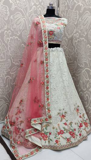 Rich And Elegant Looking Heavy Designer Lakhnavi Lehenga Choli Is Here In White Color Paired With Pretty Pink Colored Dupatta. This Heavy Embroidered Lehenga Choli Is Fabricated On Georgette Paired With Net Fabricated Dupatta. Buy This Lovely Piece Now.