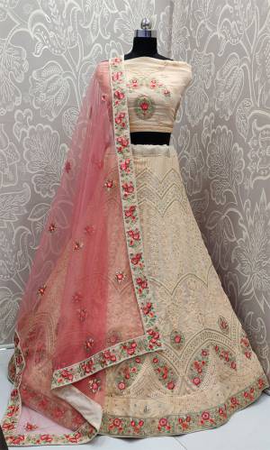Get Ready For The Upcoming Wedding Season With This Very Beautiful And Heavy Designer Lehenga Choli In Peach Color Paired With Contrasting Pink Colored Dupatta. Its Blouse And Lehenga Are Georgette Based Paired With net Fabricated Dupatta. It IS Beautified With Heavy Lakhnavi Embroidery. 