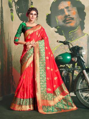 Adorn The Proper Traditional Look Wearing This Designer Silk Based Saree In Red Color Paired With Contrasting Green Colored Blouse. It Is Beautified With Pretty Attractive Weave All Over. 