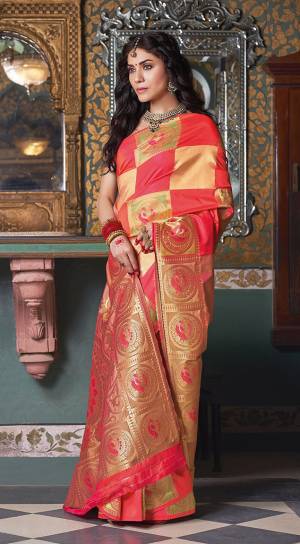 Here Is A Very Pretty Saree In Red And Gold Color Fabricated On Art Silk. It Is Beautified With Bold Weave Giving You A Royal Look. 