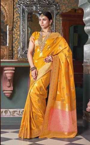 Celebrate This Festive Season In This Rich Looking Designer Saree In Musturd Yellow Color Paired With Musturd Yellow Colored Blouse. This Saree And Blouse Are Silk Based Beautified With Weave All Over. 