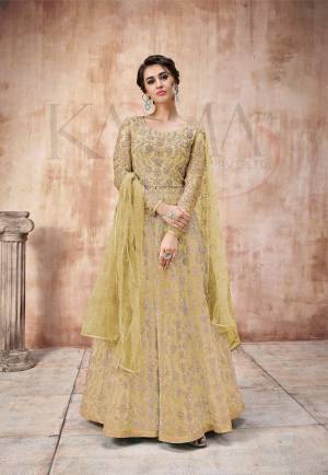Add This Very Pretty Heavy Designer Floor Length Suit To Your Wardrobe In All Over Pear Green Color. Its Heavy Embroidered Top IS Fabricated On Net Paired With Satin Silk Bottom And Net Fabricated Dupatta. It Is Light In Weight And Easy To Carry Throughout The Gala. Buy Now.