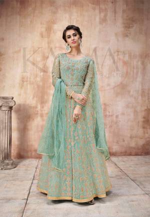 Add This Very Pretty Heavy Designer Floor Length Suit To Your Wardrobe In All Over Aqua Blue Color. Its Heavy Embroidered Top IS Fabricated On Net Paired With Satin Silk Bottom And Net Fabricated Dupatta. It Is Light In Weight And Easy To Carry Throughout The Gala. Buy Now.