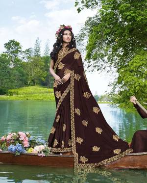 Grab This Very Beautiful And Elegant Looking Designer Saree In Brown Color Paired With Brown Colored Blouse. This Saree Is Fabricated On Georgette Paired With Art Silk Fabricated Blouse. This Saree Is Light In Weight And Easy To Carry All Day Long. 