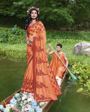 Grab This Very Beautiful And Elegant Looking Designer Saree In Orange Color Paired With Red Colored Blouse. This Saree Is Fabricated On Silk Georgette Paired With Art Silk Fabricated Blouse. This Saree Is Light In Weight And Easy To Carry All Day Long. 