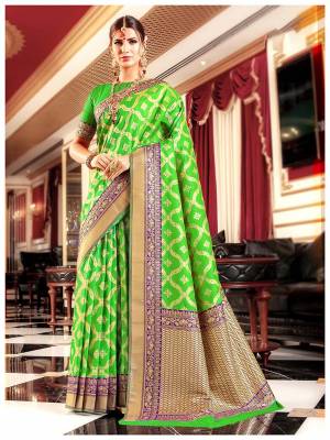 Bright And Visually Appealing Color Is Here With This Pretty Saree In Parrot Green Color Paired With Parrot Green Colored Blouse. This Saree And Blouse Are Silk Based Beutified With Weave All Over It. Buy This Saree Now.