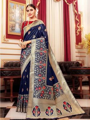 Celebrate This Festive Season A Proper Traditional Wear With This Saree In Navy Blue Color Paired With Contrasting Rani Pink Colored Blouse. This Saree And Blouse Are Silk Based Which Gives A Rich Look To Your Personality. 