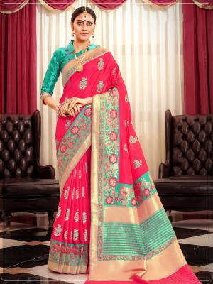 Bright And Visually Appealing Color Is Here With This Pretty Saree In Dark Pink Color Paired With Sea Blue Colored Blouse. This Saree And Blouse Are Silk Based Beutified With Weave All Over It. Buy This Saree Now.