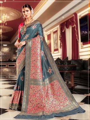 Celebrate This Festive Season A Proper Traditional Wear With This Saree In Grey Color Paired With Contrasting Rani Pink Colored Blouse. This Saree And Blouse Are Silk Based Which Gives A Rich Look To Your Personality. 