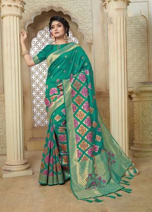 Celebrate This Festive Season With Beauty And Comfort Wearing This Pretty Silk Based Saree In Sea Green Color Paired With Sea Green Colored Blouse. This Saree And Blouse Are Fabricated On Banarasi Art Silk Beautified With Weave All Over. 