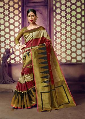 Celebrate This Festive Season With Beauty And Comfort In This Light Weight Silk Based Saree In Olive Green And Maroon Color. This Pretty Weaved Saree And Blouse Are Fabricated On Art Silk Which Gives A Rich Look To Your Personality. 