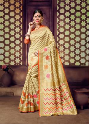 Celebrate This Festive Season With Beauty And Comfort In This Light Weight Silk Based Saree In Cream And Orange Color. This Pretty Weaved Saree And Blouse Are Fabricated On Art Silk Which Gives A Rich Look To Your Personality. 