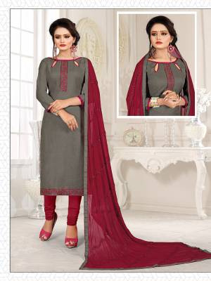 Here Is A Pretty Dress Material For Your Casual Or Semi-Casual Wear In Grey And Maroon Color. Its Top Is Fabricated On Cotton Slub Paired With Cotton Bottom And Chiffon Fabricated Dupatta. Get This Stitched As Per Your Desired Fit And Comfort. 