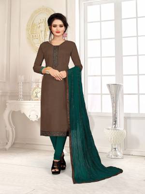 Here Is A Pretty Dress Material For Your Casual Or Semi-Casual Wear In Brown And Teal Green Color. Its Top Is Fabricated On Cotton Slub Paired With Cotton Bottom And Chiffon Fabricated Dupatta. Get This Stitched As Per Your Desired Fit And Comfort. 
