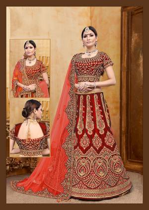 Get Ready For Your D-Day With This Heavy Designer Bridal Lehenga?Choli In Red Color Paired With Red Colored Dupatta. Its Heavy Embroidered Blouse And Lehenga Are Fabricated On Velvet Paired With Net Fabricated Dupatta.