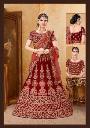 Get Ready For Your D-Day With This Heavy Designer Bridal Lehenga?Choli In Red Color Paired With Red Colored Dupatta. Its Heavy Embroidered Blouse And Lehenga Are Fabricated On Velvet Paired With Net Fabricated Dupatta.